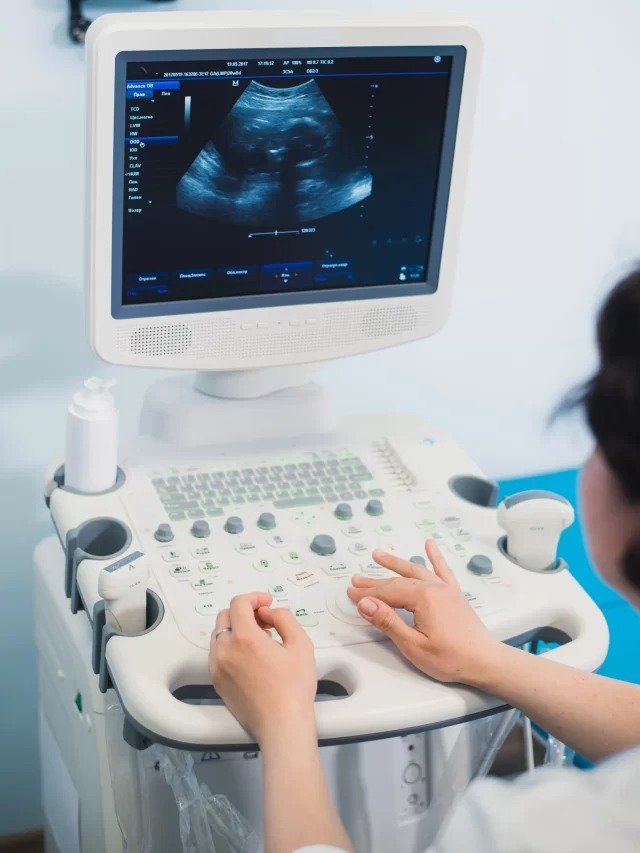 cropped-skillful-sonographer-using-ultrasound-machine-work-scaled-1